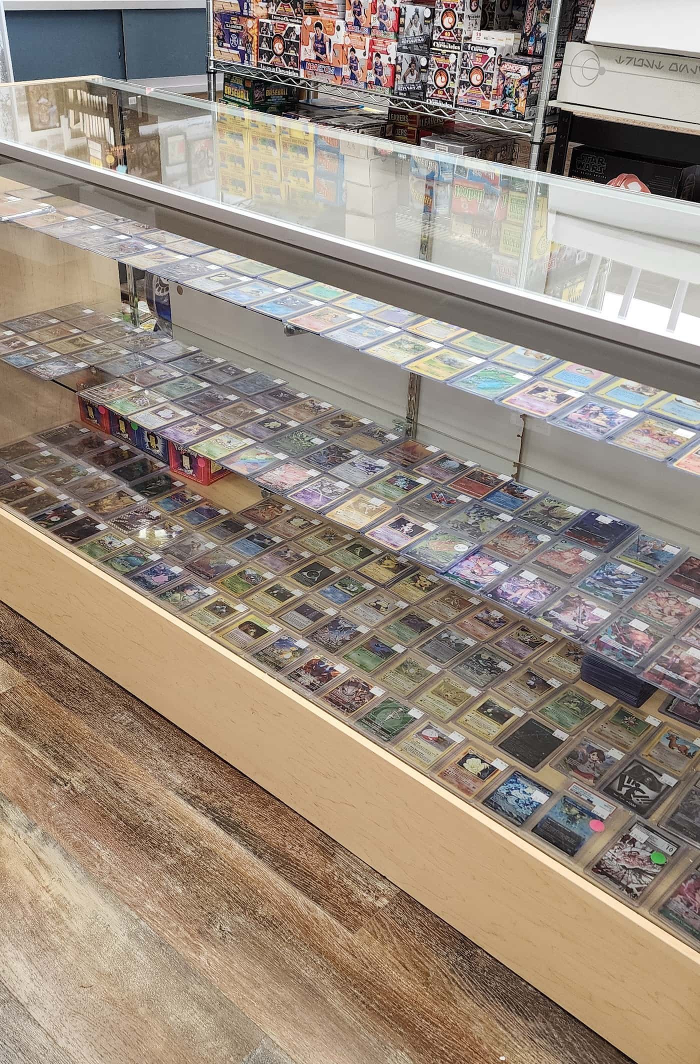 Showcase of sports cards and Pokémon cards at East Carolina Collectibles